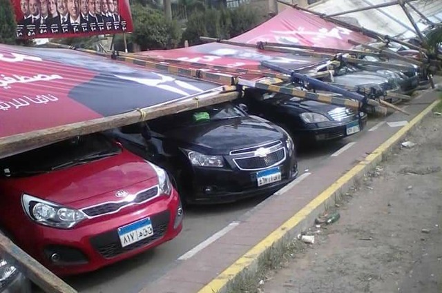 أضرار لعدد من السيارات بسبب يافطات انتخابات الأهلى